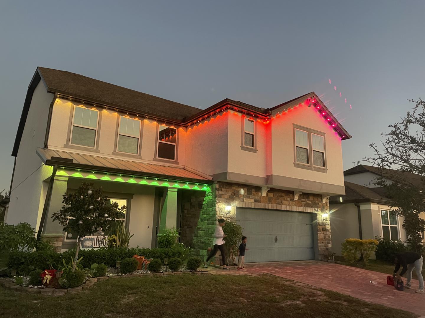 Home with permanent holiday lighting along the roofline